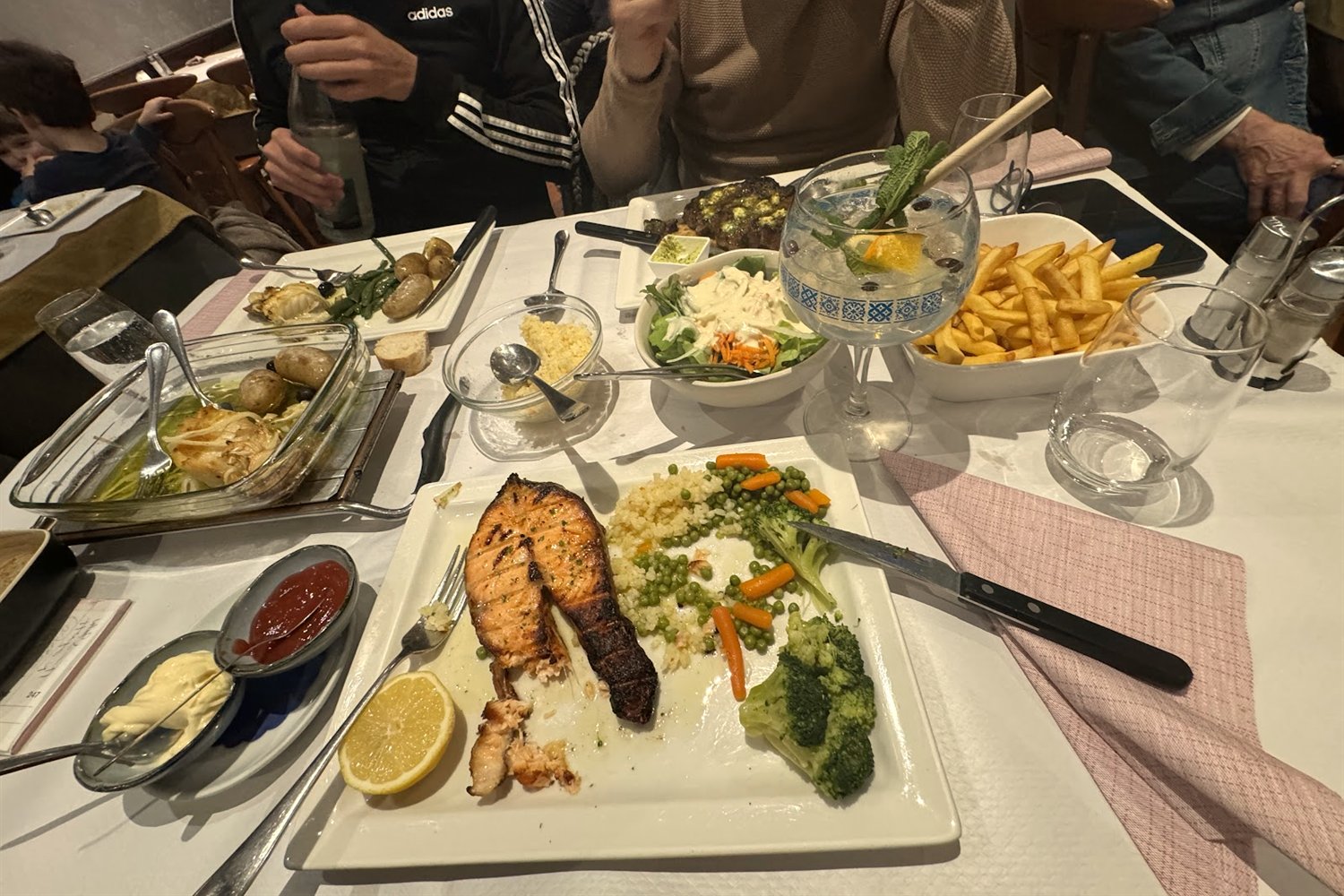 Shared table spread for a group at Um Grill